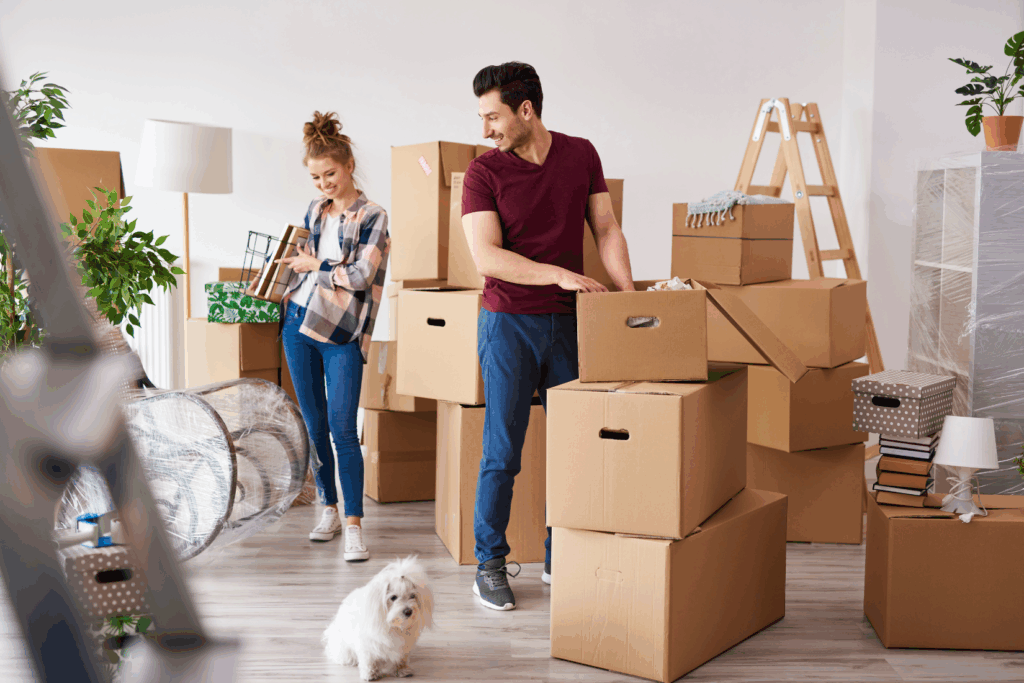 Happy couple sold their home and packing boxes to move 