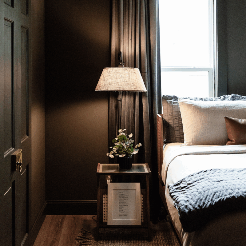 cozy bedroom with linen light and mid-century styled furniture