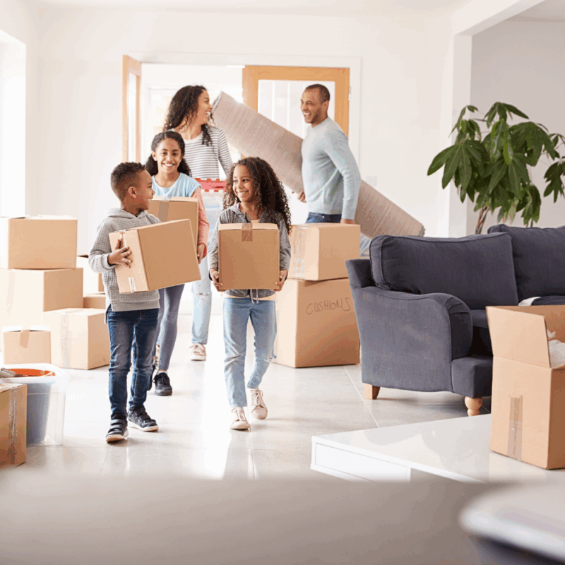 family packing home to sell before buying a house