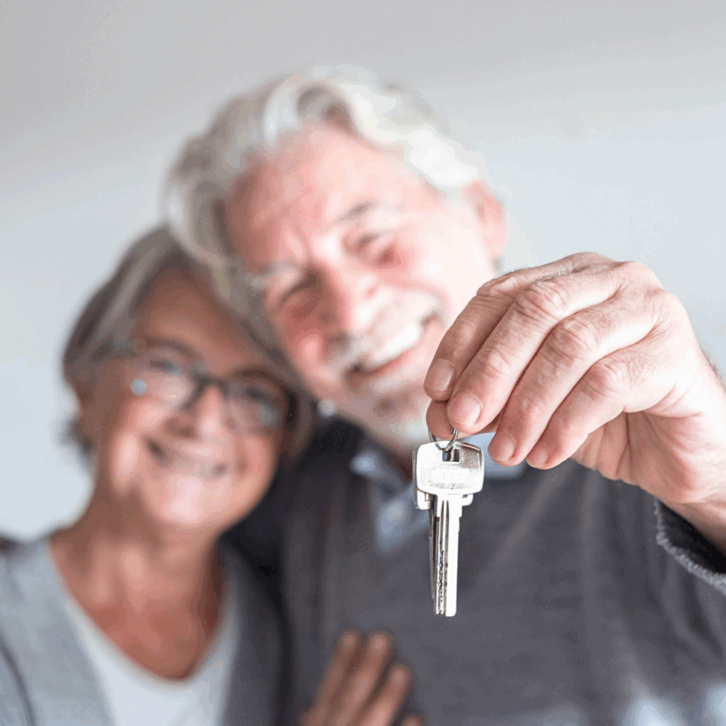 skip traditional home selling, happy couple giving keys