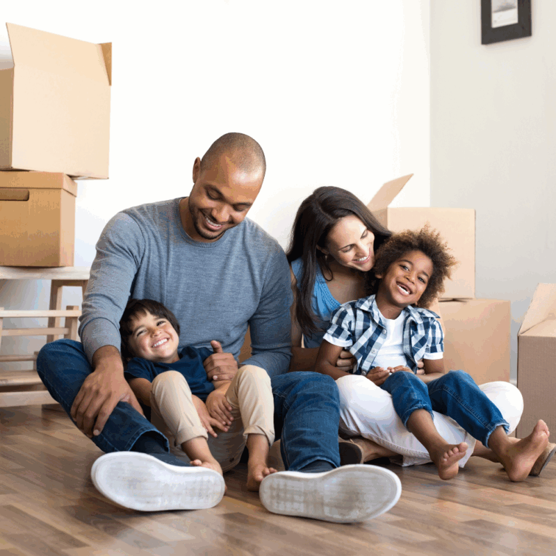 Family packing moving boxes, relocation, Thomson GA