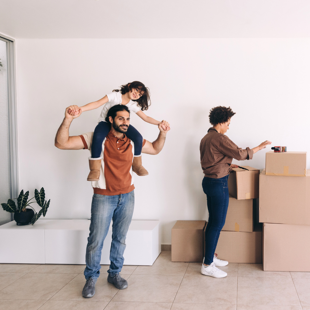 Family packing moving boxes, relocation, North Augusta SC